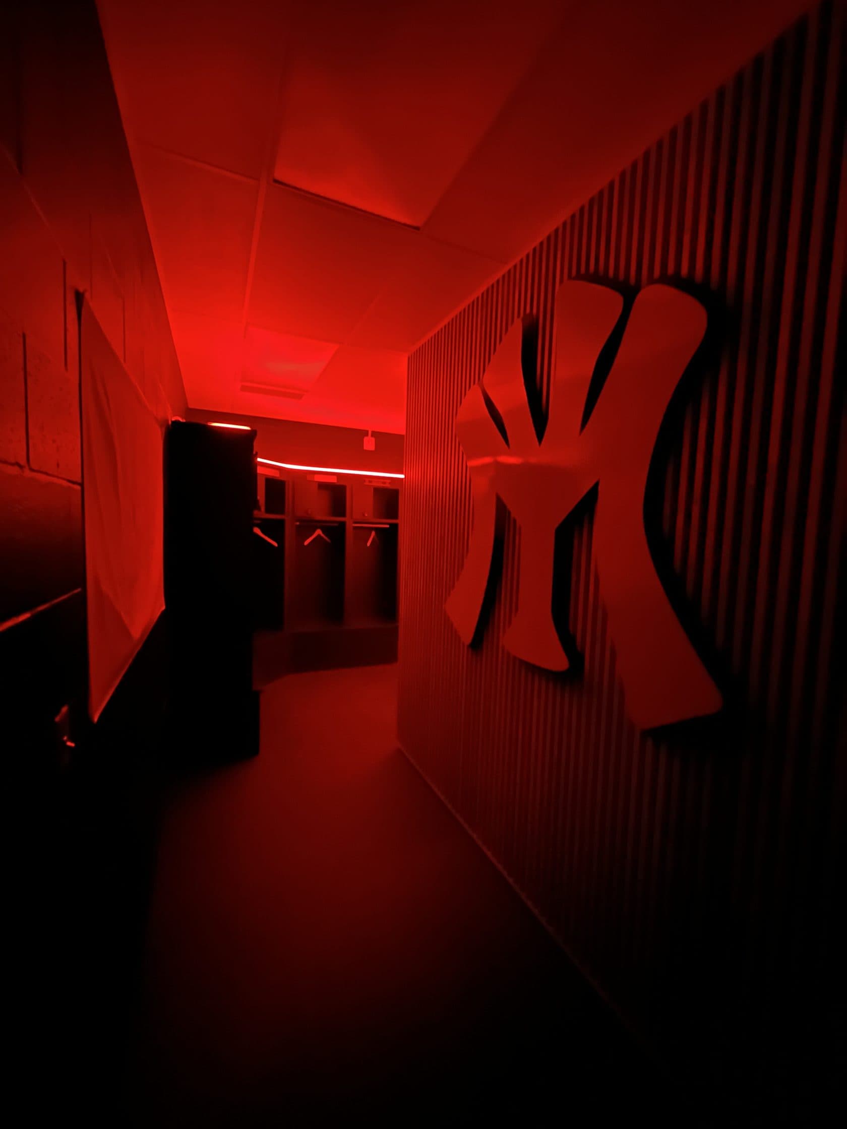 YM mark on the clubhouse wall under red light