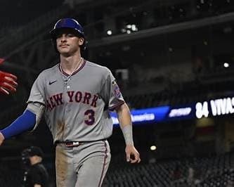 Carson Benge walking in a New York Mets road jersey with NEW YORK across the chest