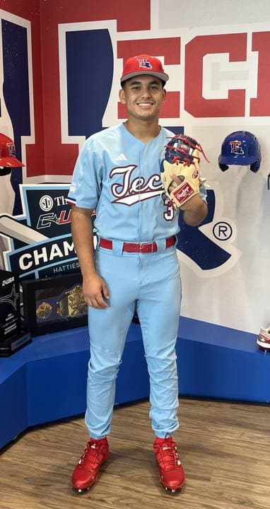 Eddie Fish in a Louisiana Tech uniform, holding a glove